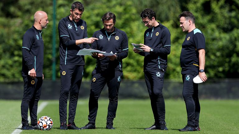 Alex Silva, Assistant Head Coach of Wolverhampton Wanderers, Bruno Lage, Manager of Wolverhampton Wanderers, Carlos Cachada, First-team fitness coach of Wolverhampton Wanderers, Luis Nascimento, Senior professional development coach of Wolverhampton Wanderers and Jhony Conceicao, Head of coaching strategy of Wolverhampton Wanderers look on during a Wolverhampton Wanderers Pre-Season Training Session at Sir Jack Hayward Training Ground on July 13, 2021
