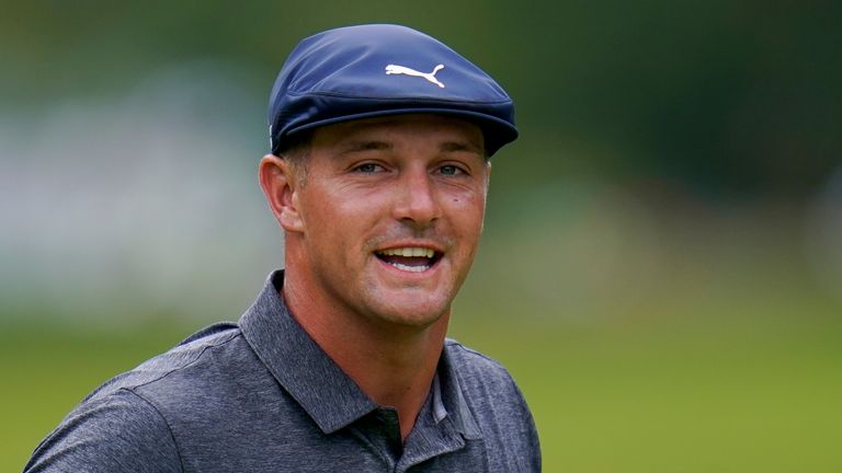 Bryson DeChambeau reacts after putting on the first green during the final round of the BMW Championship golf tournament, Sunday, Aug. 29, 2021, at Caves Valley Golf Club in Owings Mills, Md. (AP Photo/Julio Cortez)