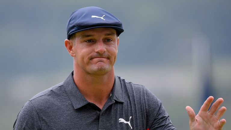 Bryson DeChambeau reacts after missing his putt on the ninth green during the final round of the BMW Championship golf tournament, Sunday, Aug. 29, 2021, at Caves Valley Golf Club in Owings Mills, Md. (AP Photo/Nick Wass)