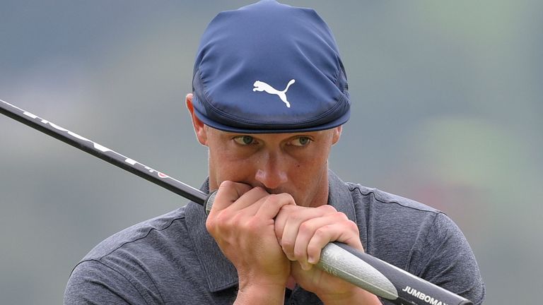 Bryson DeChambeau reacts after missing his putt on the ninth green during the final round of the BMW Championship golf tournament, Sunday, Aug. 29, 2021, at Caves Valley Golf Club in Owings Mills, Md. (AP Photo/Nick Wass)