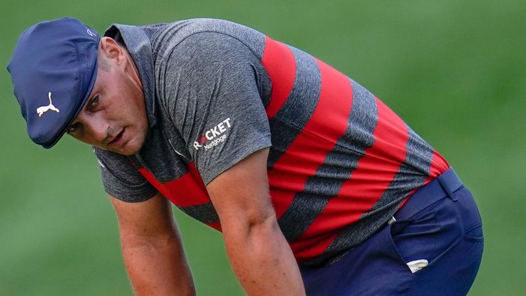 Bryson DeChambeau reacts after missing a putt on the 17th green, the third playoff hole against Patrick Cantlay during the final round of the BMW Championship golf tournament, Sunday, Aug. 29, 2021, at Caves Valley Golf Club in Owings Mills, Md. (AP Photo/Julio Cortez)