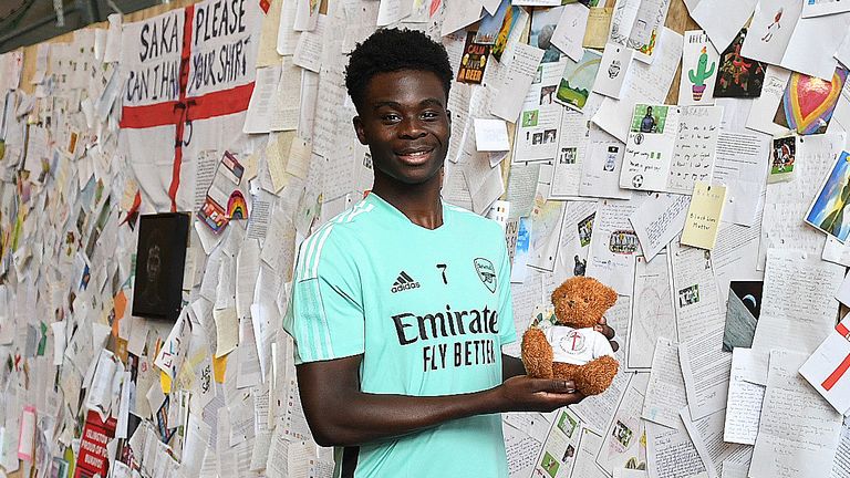 Bukayo Saka is presented with wall of fans' well-wishes