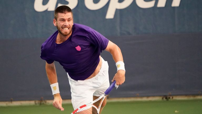 Cameron Norrie, of Britain, serves to Carlos Alcaraz, of Spain, during the first round of the US Open tennis championships, Monday, Aug. 30, 2021, in New York. (AP Photo/Elise Amendola)