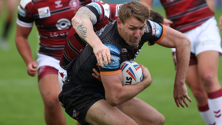 Michael Shenton in action with Wigan Warriors' John Bateman  