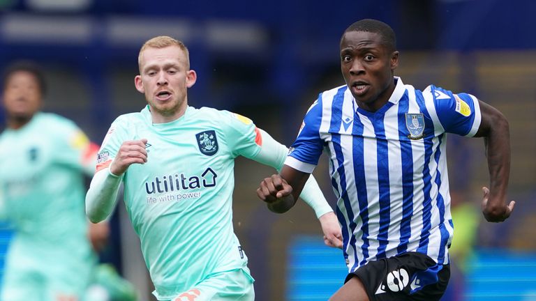 Dennis Adeniran and Lewis O'Brien battle for the ball