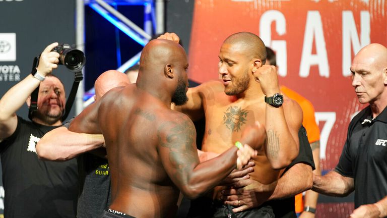 Derrick Lewis (left) and Ciryl Gane (right) steps on the scale and then face-off during the ceremonial weigh-in for UFC 265 on August 06, 2021, at Hyatt Regency in Houston, TX. (Photo by Louis Grasse/PxImages/Icon Sportswire) (Icon Sportswire via AP Images)