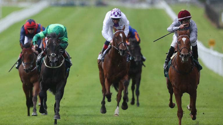 Ebro River, ridden by jockey Shane Foley (right), on their way to winning the Keeneland Phoenix Stakes at Curragh