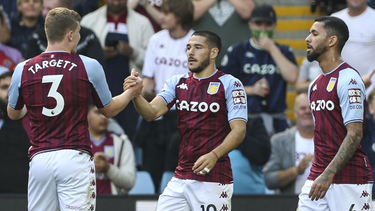 Emi Buendia celebrates his equaliser with Villa teammates