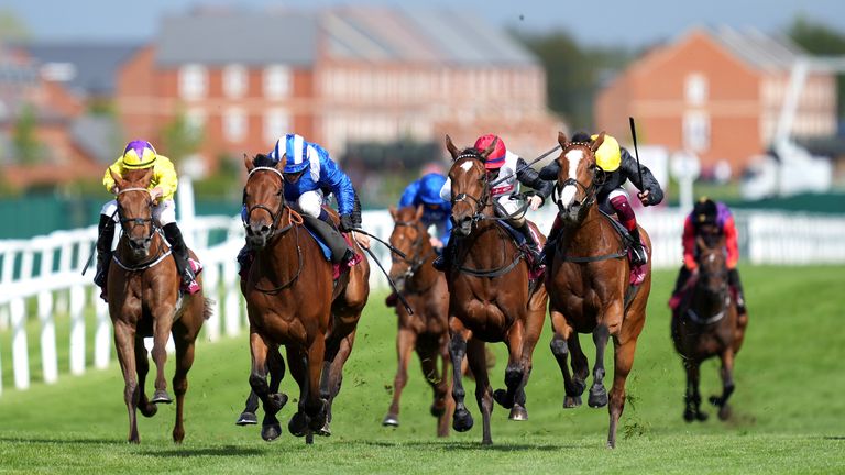 Eshaada (blue and white) wins at Newbury in May