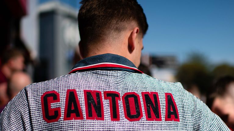 EXPRESSIONIST - A Man Utd fan wears a replica jersey featuring Cantona and the number 7 on the back

ORIGIAL CAPTION - MANCHESTER, ENGLAND - AUGUST 24:   (EDITOR'S NOTE: Image processed using a digital filter)  Manchester United fans arrive ahead of the Premier League match between Manchester United and Crystal Palace at Old Trafford on August 24, 2019 in Manchester, United Kingdom. (Photo by Ash Donelon/Manchester United via Getty Images)