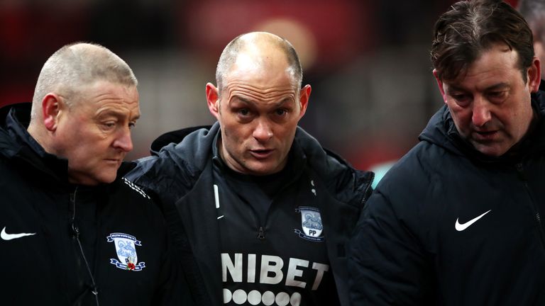 Preston North End manager Alex Neil consults with assistant Frankie McAvoy in 2020
