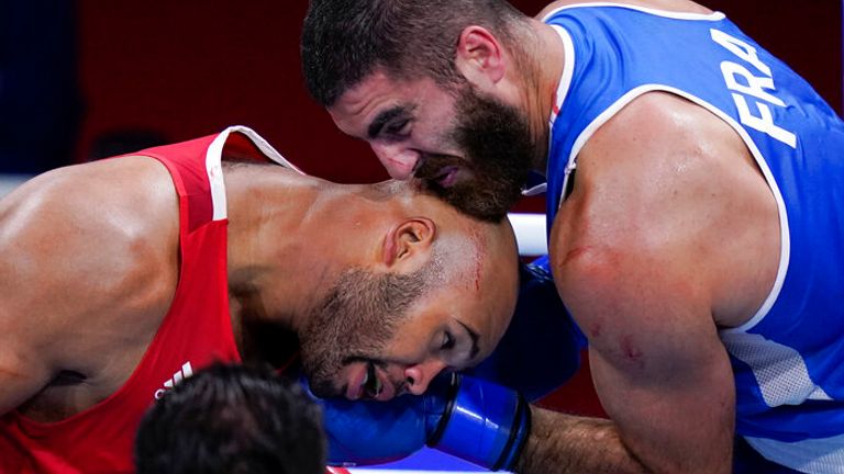 Eliad Mourad, of France punches Britain's Frazer Clarke during a men...s super heavyweight over 91-kg boxing match at the 2020 Summer Olympics, Sunday, Aug. 1, 2021, in Tokyo, Japan. (AP Photo/Frank Franklin II)