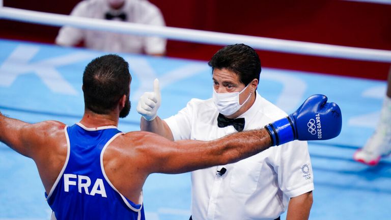 Eliad Mourad, of France reacts as he is disqualified by the referee during a men...s super heavyweight over 91-kg boxing match against Britain's Frazer Clarke at the 2020 Summer Olympics, Sunday, Aug. 1, 2021, in Tokyo, Japan. (AP Photo/Frank Franklin II)