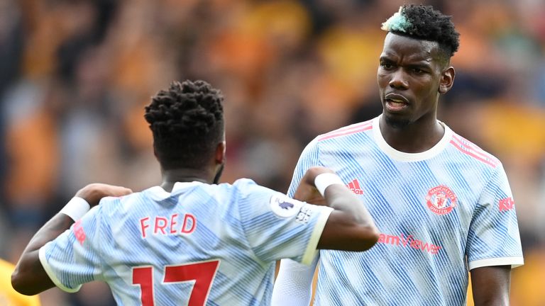 Fred and Paul Pogba in discussions during Manchester United's victory over Wolves at Molineux