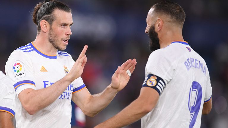 Gareth Bale celebrates with Karim Benzema after scoring