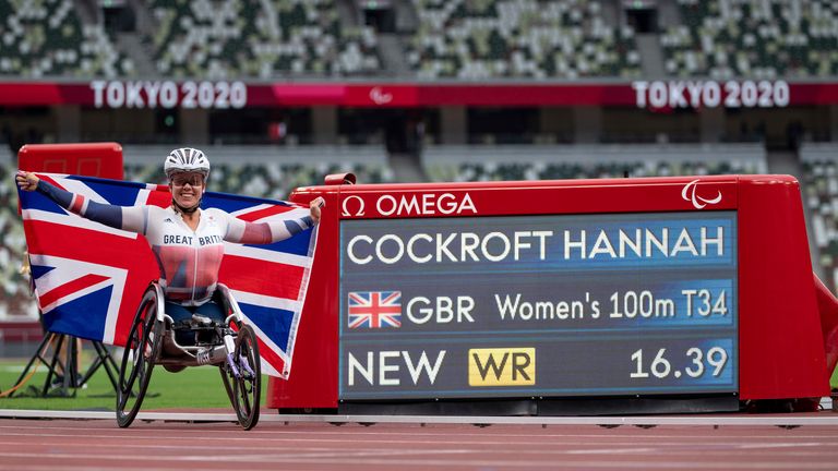 Hannah Cockroft next to her new world record time of 16.39 seconds w