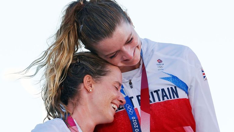 Mills and McIntyre collect their gold medals on the podium