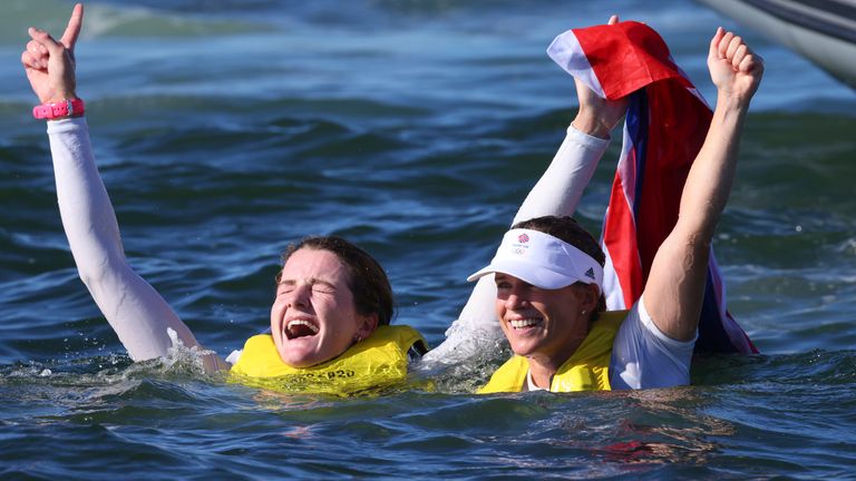 Hannah Mills and Eilidh McIntyre of Great Britain react after winning the women's 470 gold medal at Enoshima Harbour