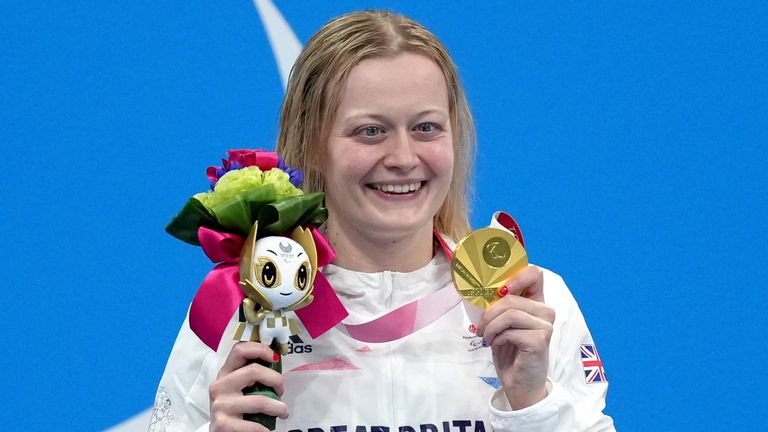 Hannah Russell celebrates on the podium