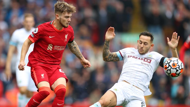 Harvey Elliott of Liverpool is challenged by Burnley's Josh Brownhill