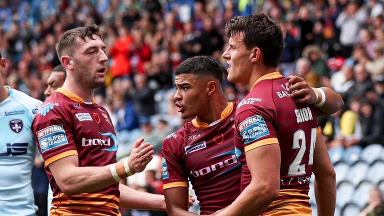Louis Senior celebrates scoring a try for Huddersfield Giants against Wakefield Trinity in Super League