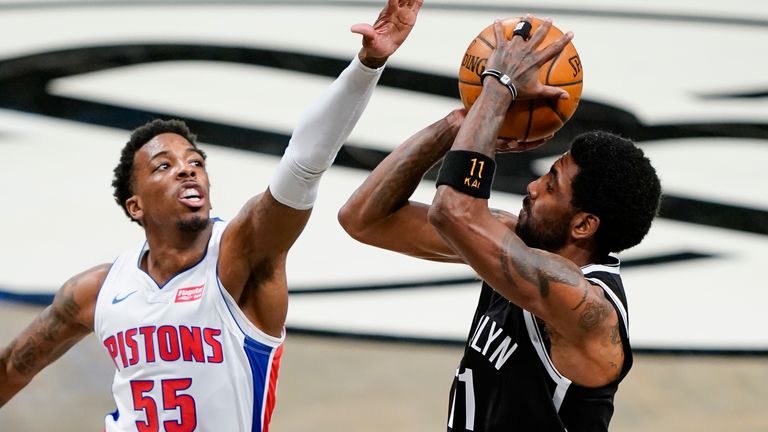 Brooklyn Nets guard Kyrie Irving (11) shoots against Detroit Pistons guard Delon Wright (55) during the first half of an NBA basketball game Saturday, March 13, 2021, in New York.
