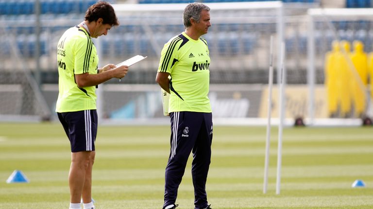 Head coach Jose Mourinho (R) of Real Madrid follows his players beside his assistant Aitor Karanka during a training session at Valdebebas training ground on July 16, 2012 in Madrid, Spain. 