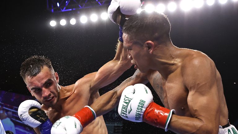 CATOOSA, OKLAHOMA - AUGUST 14: Andrew Moloney (L) and Joshua Franco (R) exchange punches during their fight for the WBA super flyweight championship at Hard Rock Hotel & Casino Tulsa on August 14, 2021 in Catoosa, Oklahoma. (Photo by Mikey Williams/Top Rank Inc via Getty Images)