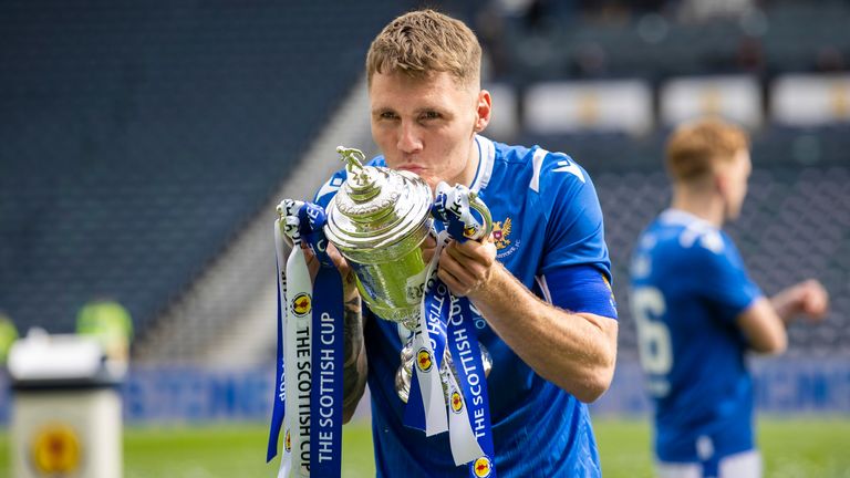 St Johnstone captain Jason Kerr lifts the Scottish Cup trophy  after beating Hibernian in the final