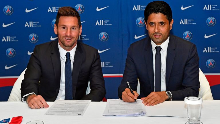 Lionel Messi signs his two-year contract with Paris Saint-Germain president Nasser Al-Khelaifi