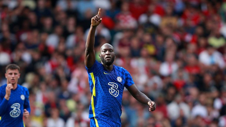 Chelsea's Romelu Lukaku celebrates after scoring his side's opening goal during the English Premier League soccer match between Arsenal and Chelsea at the Emirates stadium in London, England, Sunday, Aug. 22, 2021.