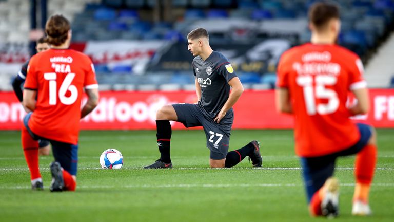 PA - Luton and Brentford take a knee