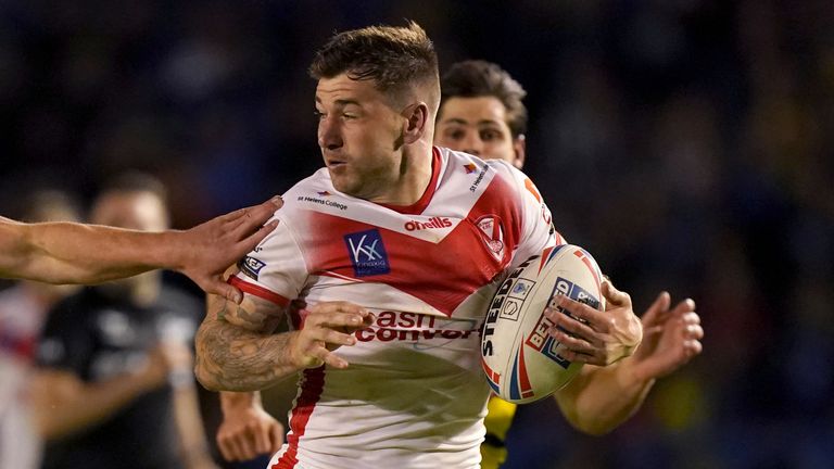 Warrington Wolves v St Helens - Betfred Super League - Halliwell Jones Stadium
St Helens&#39; Mark Percival (left) the the way to scoring their side&#39;s third try during the Betfred Super League match at the Halliwell Jones Stadium, Warrington. Picture Date: Monday August 30, 2021.