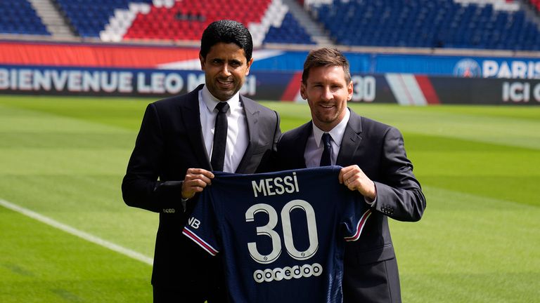 Lionel Messi, right, and PSG president Nasser Al-Al-Khelaifi hold Messi&#39;s jersey Wednesday, Aug. 11, 2021 at the Parc des Princes stadium in Paris.