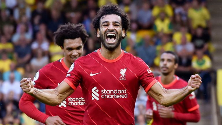 Liverpool's Mohamed Salah celebrates after scoring his side's third goal