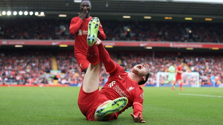 Naby Keita looks concerned after Andy Robertson landed awkwardly on his ankle