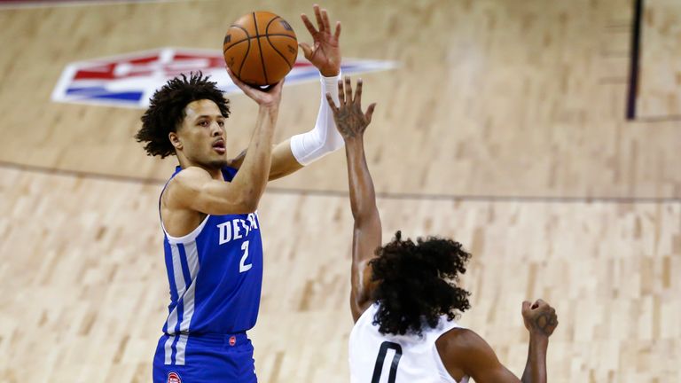 Detroit Pistons' Cade Cunningham (2) shoots over Houston Rockets Jalen Green during the NBA summer league 