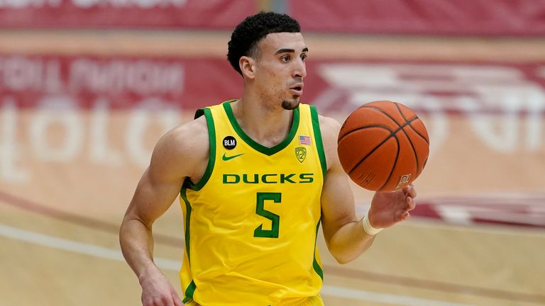 Oregon guard Chris Duarte (5) dribbles the ball up the court against Stanford during the first half of an NCAA college basketball game in Stanford, Calif., Thursday, Feb. 25, 2021. (AP Photo/Jeff Chiu)