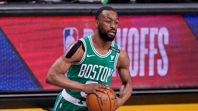 Boston Celtics guard Kemba Walker (8) looks to pass during the first quarter of Game 2 of an NBA basketball first-round playoff series against the Brooklyn Nets, Tuesday, May 25, 2021, in New York.  (AP Photo/Kathy Willens)