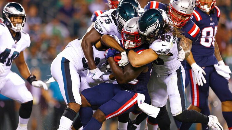 New England Patriots&#39; Sony Michel (26) is stoped by Philadelphia Eagles&#39; Grayland Arnold (37), Tarron Jackson (75) and Alex Singleton (49) during a pre-season NFL football game, Thursday, Aug. 19, 2021, in Philadelphia. (AP Photo/Rich Schultz)