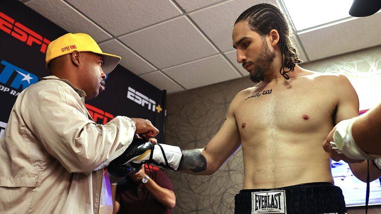 CATOOSA, OKLAHOMA - AUGUST 14: Nico Ali Walsh putting on his gloves before his fight against Jordan Weeks at Hard Rock Hotel & Casino Tulsa on August 14, 2021 in Catoosa, Oklahoma. (Photo by Mikey Williams/Top Rank Inc via Getty Images)