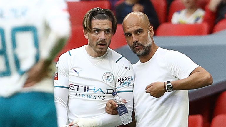 Pep Guardiola gives instructions to Jack Grealish as he prepares to come on in the second half (AP)