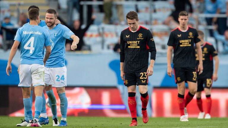 Rangers' Scott Wright looks dejected as Malmo players celebrate their opening goal