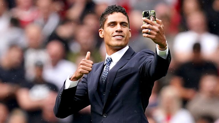 Raphael Varane takes a selfie on the pitch at Old Trafford