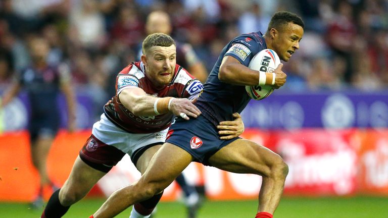 St Helens' Regan Grace and Wigan Warriors' Jackson Hastings in action