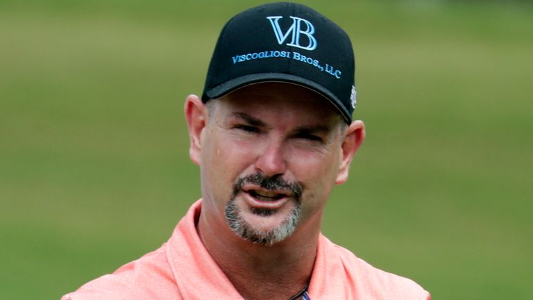 Rory Sabbatini waves to the crowd as he comes o ff the green on the second hole during the third round of the Wyndham Championship golf tournament at Sedgefield Country Club in Greensboro, N.C., Saturday, Aug. 14, 2021. (AP Photo/Chris Seward)