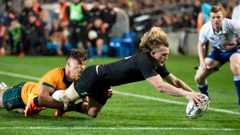 New Zealand's Damian McKenzie, right, scores a try against Australia during their Bledisloe Cup Test match at Eden Park