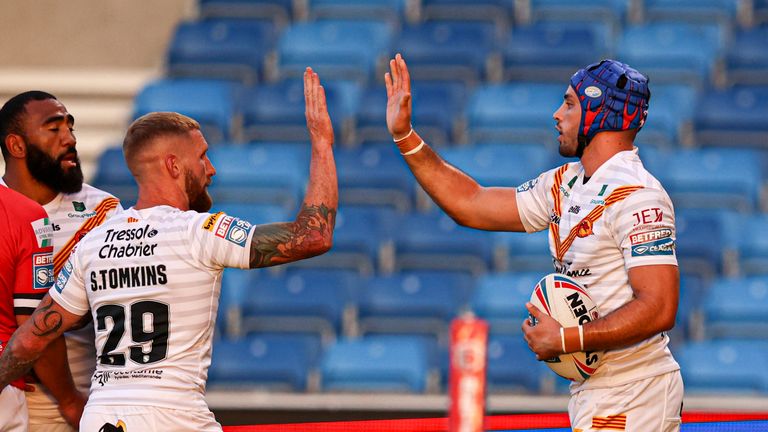 Catalans Dragons' Sam Tomkins and Benjamin Jullien celebrate