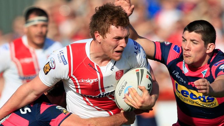 PICTURE BY CHRIS MANGNALL /SWPIX.COM...Rugby League - Super League - Hull Kingston Rovers v Leeds Rhinos - Craven Park, Hull, England - 09/04/11...Hull KR's Scott Taylor tackled by Leeds Danny Buderus and Chris Clarkson.