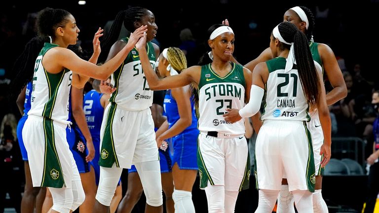 The Seattle Storm celebrate after the Commissioner's Cup WNBA basketball game against the Connecticut Sun, Thursday, Aug. 12, 2021, in Phoenix. (AP Photo/Matt York)..